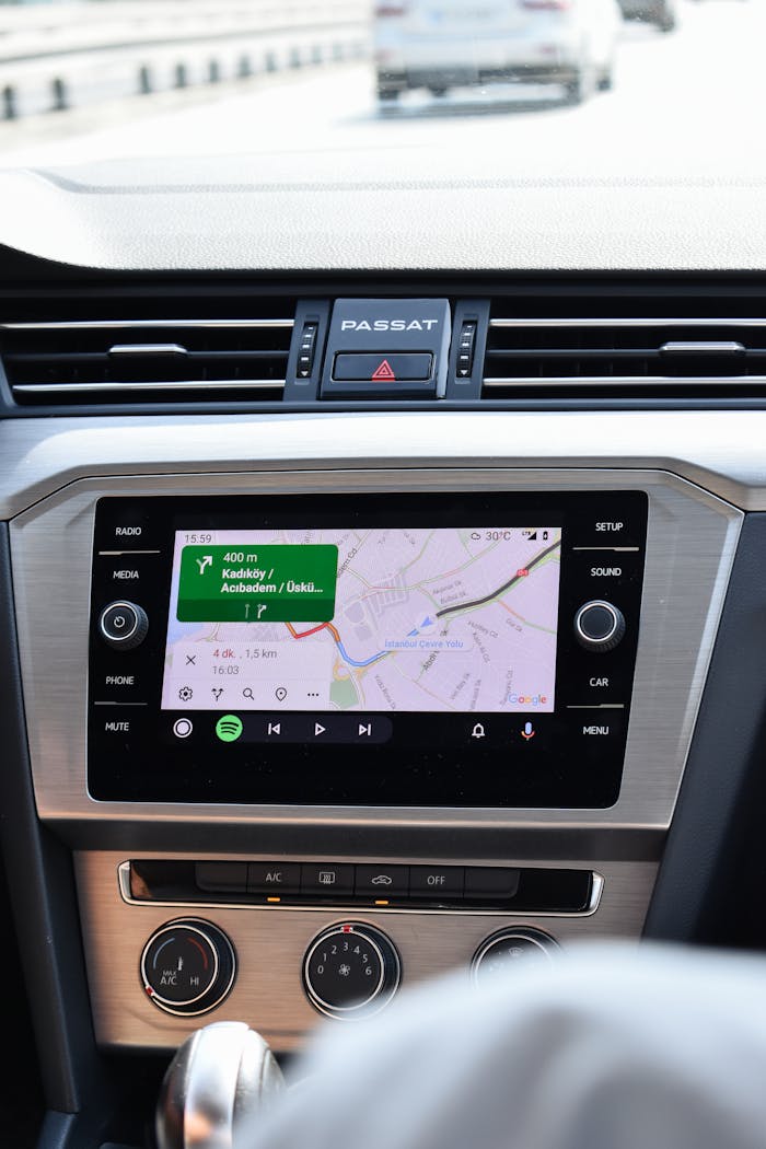 Close-up of a car GPS navigation system inside a Volkswagen Passat dashboard.