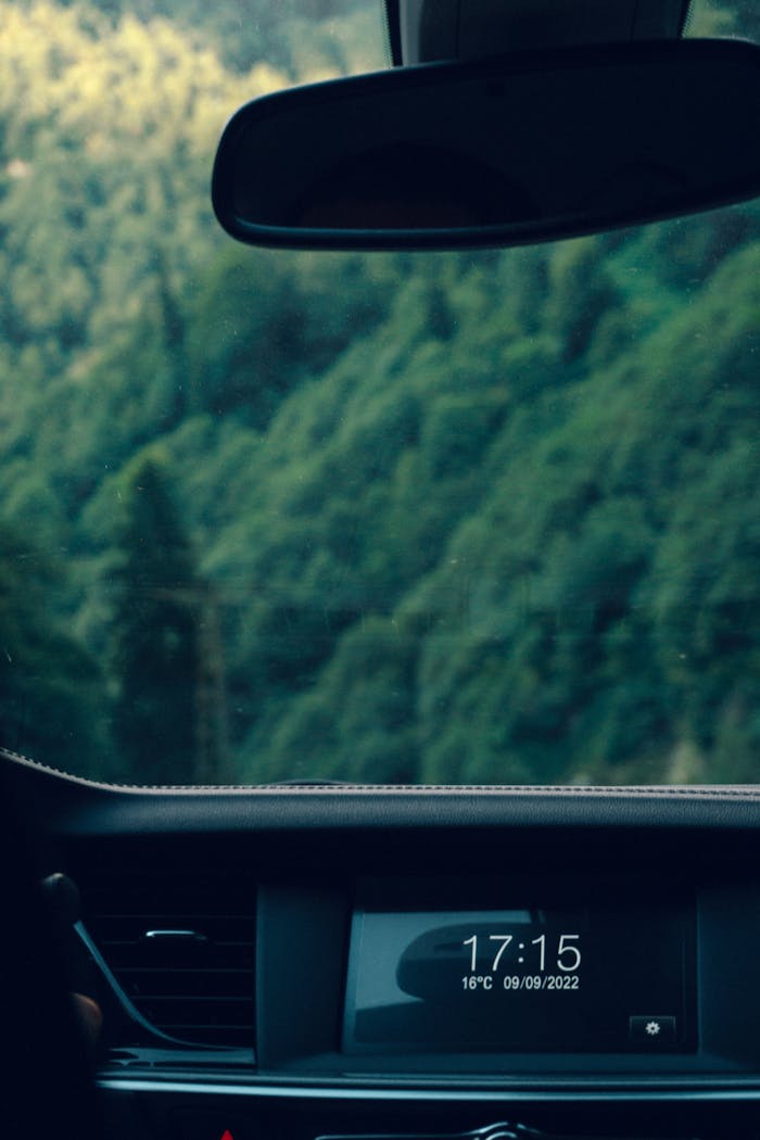 View from inside a car of the lush green mountains in Rize, Türkiye.